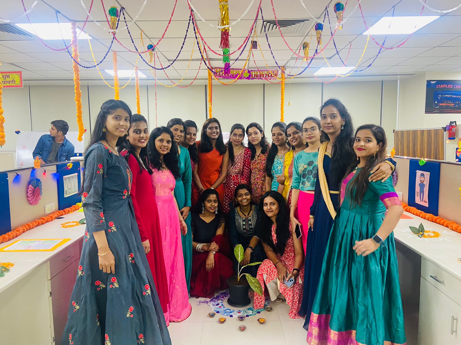 Group photo of 24/7 employees in office